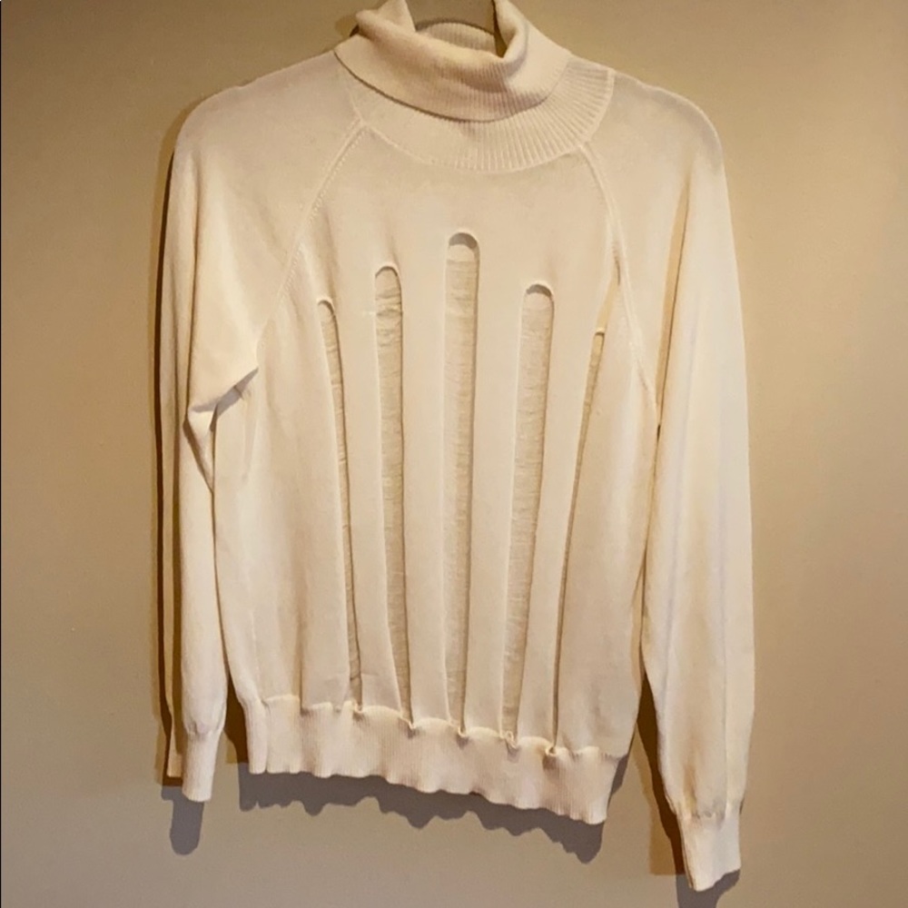 H&M trend distressed sweater.